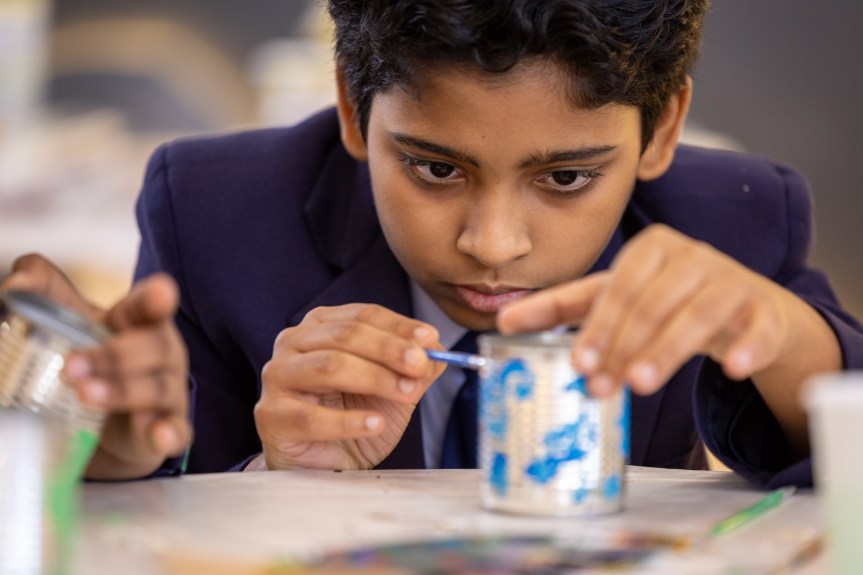 Children learn about art & the environment as they recycle cans into  planting pots at 43rd Sharjah International Book&nbsp;Fair
